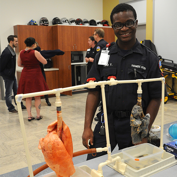 Paramedic student with a heart dummy