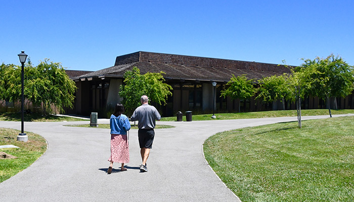 two people headed toward an pathway intersection