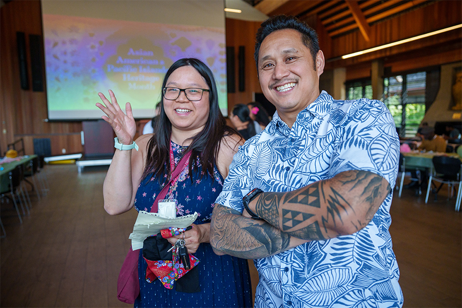 Faculty and Staff members smiling with a coffee glass 