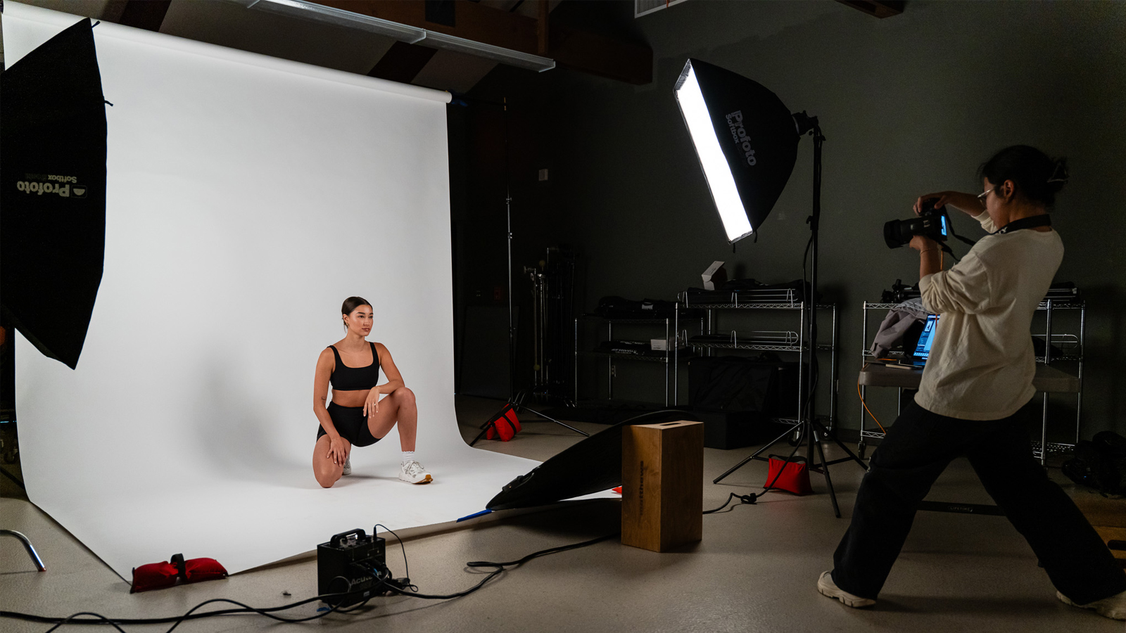 Students practicing photography at the photo studio