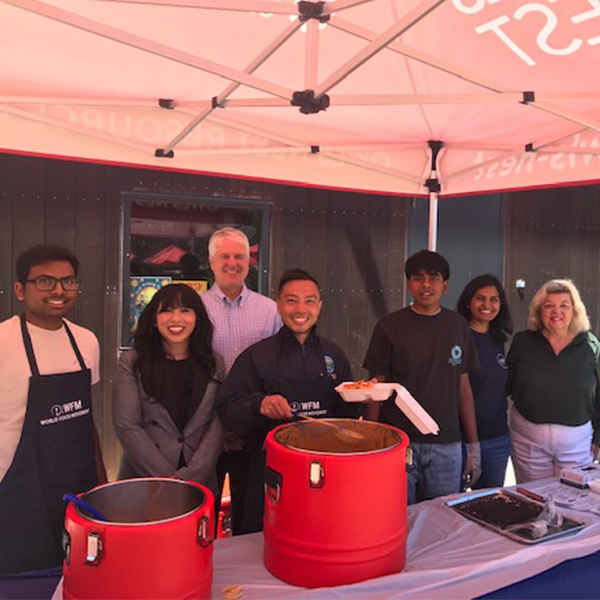 Santa Clara officers serving food to students