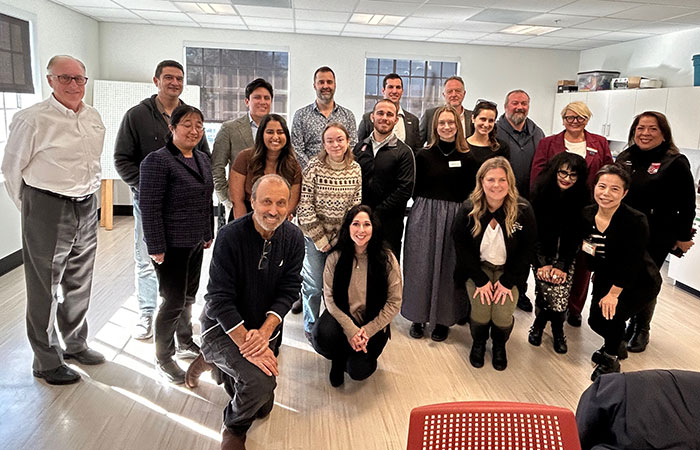 Large group of people posing for photo