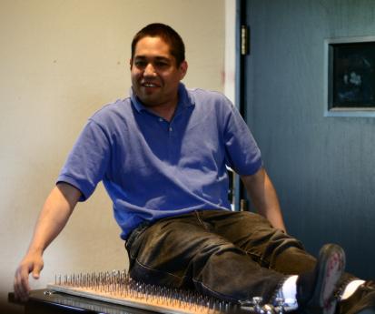 sitting on the bed of nails