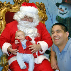 a photo of my baby and Santa