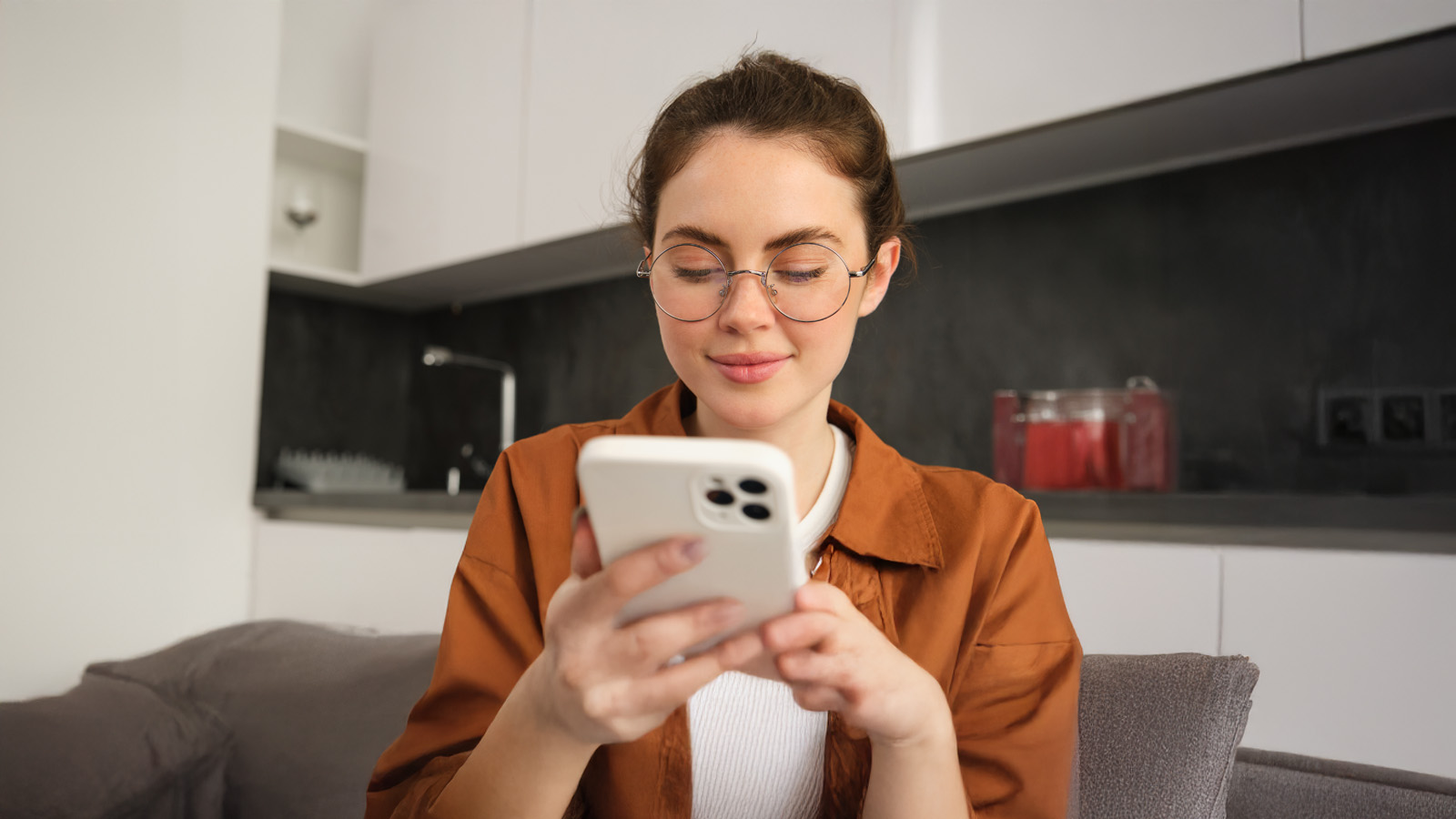 Female student searching in her phone.