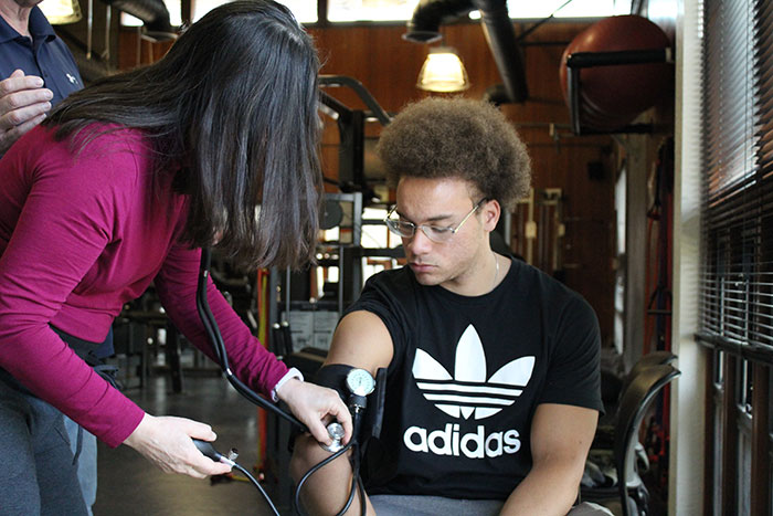student learning to take blood pressure measurement