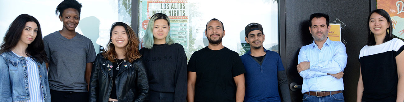 Group of five smiling students