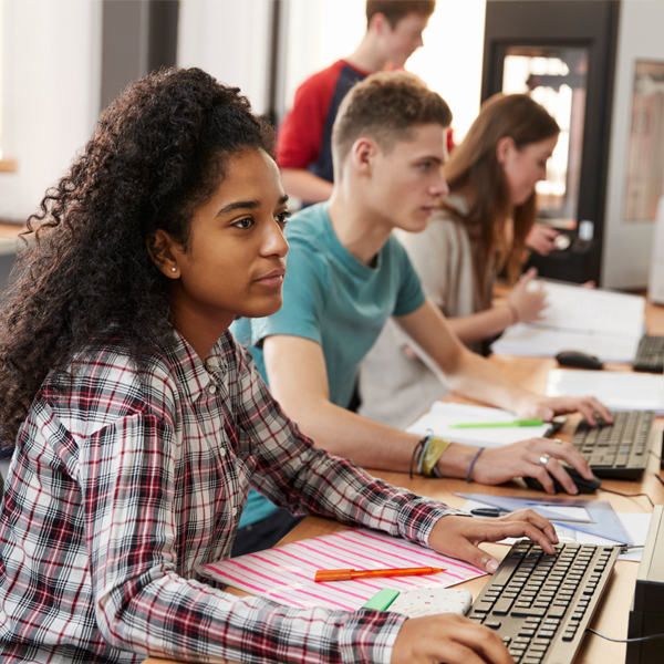 Students typing on keyboards