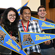 Three students with UCLA pendents