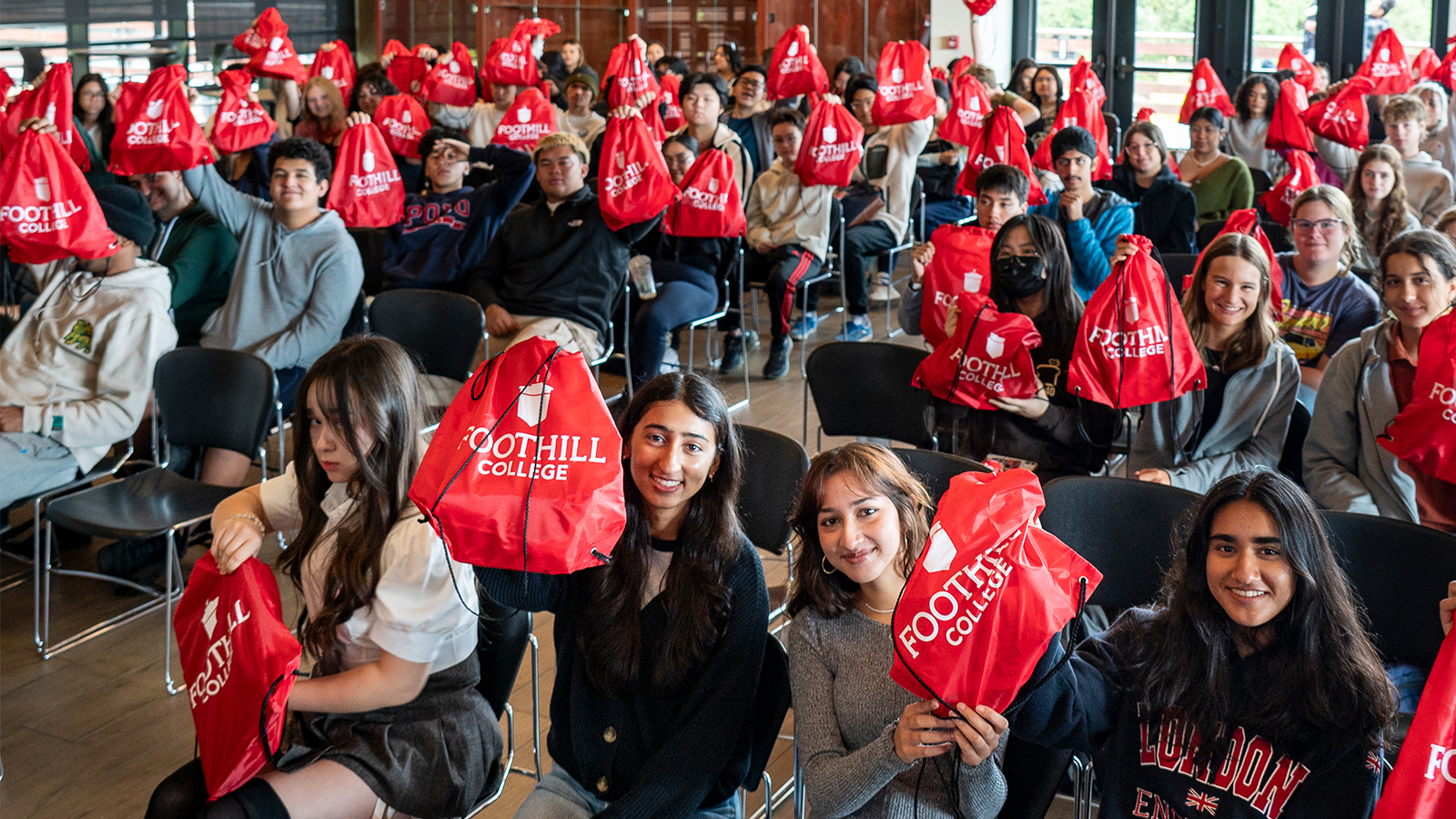 Foothill College Welcome Day Students at Auditorium showing a red bah with the college logo